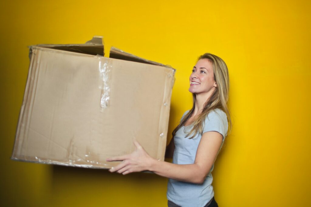 woman holding moving box