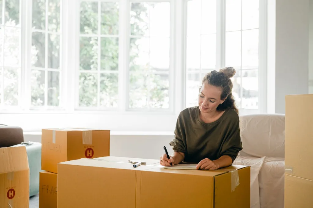 woman handling moving boxes